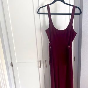 Size Medium burgundy jumpsuit.  Wide leg and adjustable straps around waist